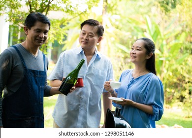 Group Of Asian Senior Early Retirement Party In Green Park Outdoor BBQ Food And Drink