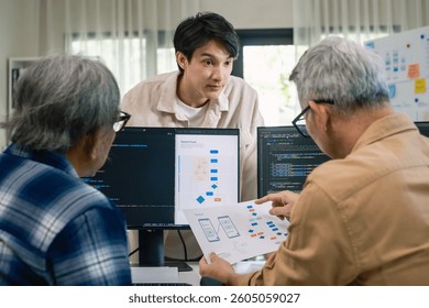 Group of asian senior learning programming software development analyzing flowcharts during a bootcamp training