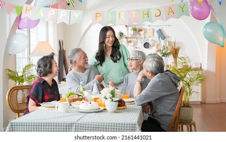 Group Of Asian Senior People Having Birthday Party At Home, Celebrating Birthday At Retirement Home With Friends