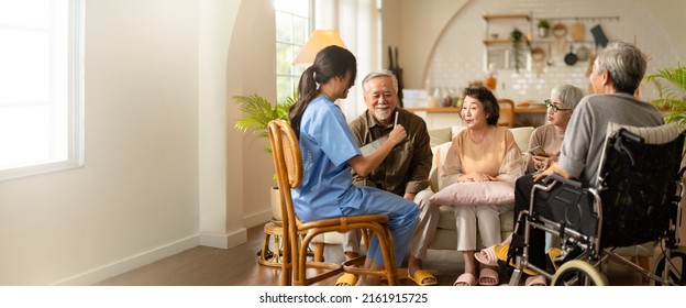 Group of asian senior people listening to young nurse. Psychological support group for elderly and lonely people in a community centre. Group therapy in session sitting in a circle in a nursing home. - Shutterstock ID 2161915725