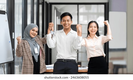 Group of asian Team laughing and cheerful in success meeting exited emotion. Creative Ethnicity teamwork holding hand and feeling happy, - Powered by Shutterstock