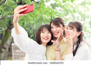 Group Of Asian Woman Taking A Selfie.