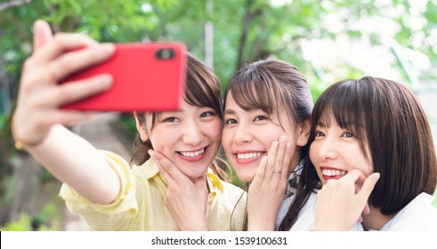 Group Of Asian Woman Taking A Selfie.