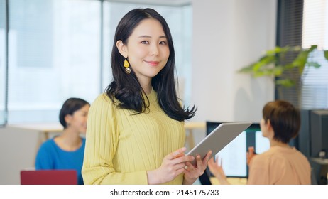 Group of Asian woman working in the office. - Powered by Shutterstock