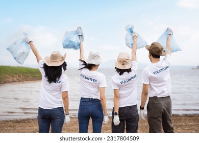 Group of Asian young people volunteer helping to collecting or picking up a plastic bottle garbage on the ground in park. Sustainability and environment conservation concept. - Powered by Shutterstock