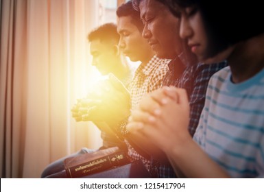 Group Of Asians Worship Hand Praying God And Bible To The Holy Scripture. Her Pray Raising To The Jesus In Church For The Faith And Spiritual Christians Concept Of Religion.