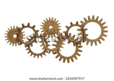 Group of assorted bronze cogwheels, various size and shape, abstract set, isolated on white background