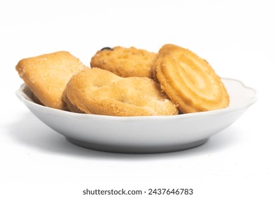 Group of assorted of danish butter cookies in a small white plate isolated on white background clipping path - Powered by Shutterstock