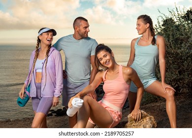 Group Of Athletes Rest After Running. Certified Instructor And His Fitness Team. Premium High Resolution Photo Of Smiling Women And Man.