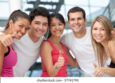 Group Of Athletic People At The Gym With Thumbs Up