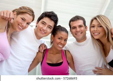 Group Of Athletic Young People At The Gym Smiling