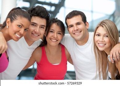 Group Of Athletic Young People At The Gym Smiling