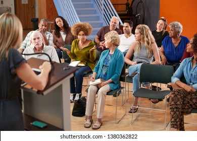 Group Attending Neighborhood Meeting In Community Center