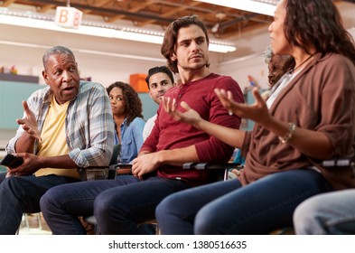 Group Attending Neighborhood Meeting In Community Center