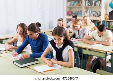 Group of attentive russian students working in a cozy classroom - Shutterstock ID 471349247