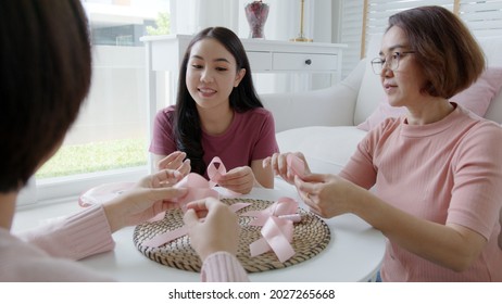 Group Of Attractive Asia Happy People Or Senior Mature Lady And Teen Girl Sit At Home Sofa Cheer Up Sign Symbol Tied In Program Workshop Class To Help Fight Prevent Female Disease Issue Health Care.