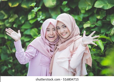 group of attractive asian woman with hijab together. best friend hugs each other