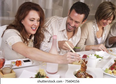 Group of attractive young professional people eating at upscale restaaurant