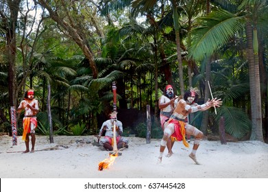 Group Of Australian Aboriginal People Dancing And Play Music Of  Indigenous Australian Dance During A Culture Show In The Tropical Far North Of Queensland, Australia. 