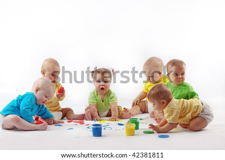 Group of babies painting