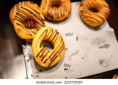 Group Of Baked Doughnut With Chocolate Topping. Sweet Food Object Photo, Selective Focus.