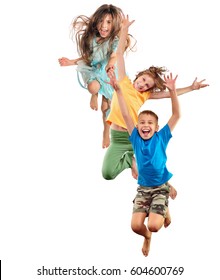 group of barefeet children shouting screaming jumping dancing. Isolated over white background. Childhood, freedom, happiness, active lifestyle concept. Young jumpers kids girls an boy - Shutterstock ID 604600769