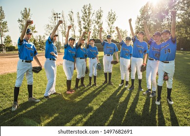 Group of baseball players standing together on the playground with fist over - Powered by Shutterstock