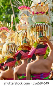 Group Of Beautiful Balinese Women In Costumes - Sarong, With Offering For Hindu Ceremony. Traditional Dances, Arts Festivals, Culture Of Bali Island And Indonesia People. Indonesian Travel Background
