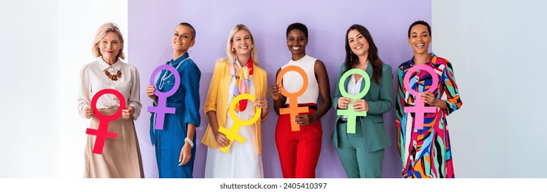 Group of beautiful confident women holding the femininity Venus symbol to celebrate women's day, concepts of women empowerment, women's right and diversity.