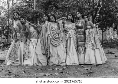Group of beautiful Indian girls. Young women in traditional Indian costume, saree, jewellry, fashionable blouse, lehenga choli  with fashionable hairstyle poses. Vadodara, Gujarat, India- May 5th 2021