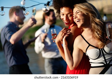 Group of beautiful people friends celebrating, dancing and having fun together outdoor