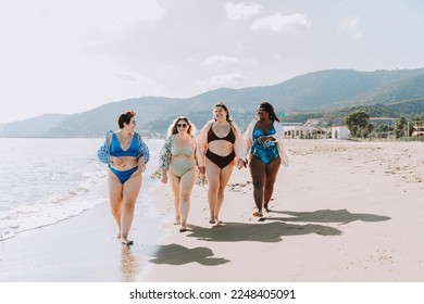 Group of beautiful plus size women with swimwear bonding and having fun at the beach - Group of curvy female friends enjoying summertime at the sea, concepts about body acceptance, body positive  - Powered by Shutterstock