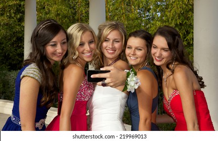 Group Of  Beautiful Teenage Girls Going To The Prom Taking A Selfie