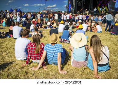 Group Of Beautiful Teens At Concert At Summer Festival