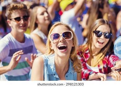 Group Of Beautiful Teens At Concert At Summer Festival