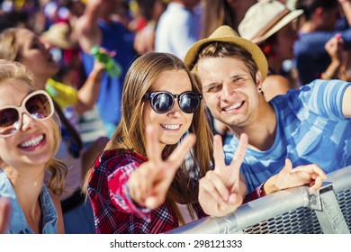 Group Of Beautiful Teens At Concert At Summer Festival