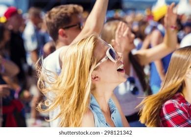 Group Of Beautiful Teens At Concert At Summer Festival