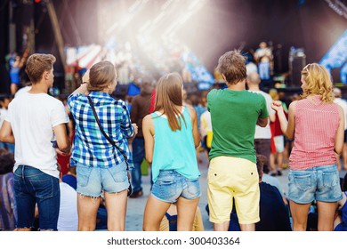 Group Of Beautiful Teens At Concert At Summer Festival