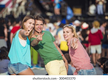 Group Of Beautiful Teens At Concert At Summer Festival