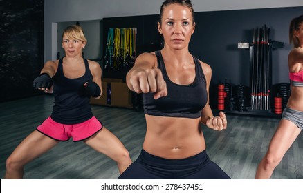 Group Of Beautiful Women In A Hard Boxing Class On Gym Training Punch