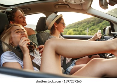 Group of best female friends travel together to summer adventure.They drives a car and making fun.
