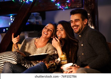 Group Best Friends Sitting At Home On Pleasant  Evening And Watching A Comedy Movie .Watching Late Night Show.