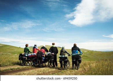 Group of bicyclists going on road. Lake Baikal island Olkhon