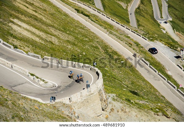 Group of bikers on the famous Passo Dello\
Stelvio Climb. Italian - Swiss border,\
Alpen\
