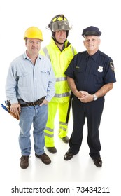 Group of blue collar workers, construction worker, policeman, and fireman, isolated on white.
