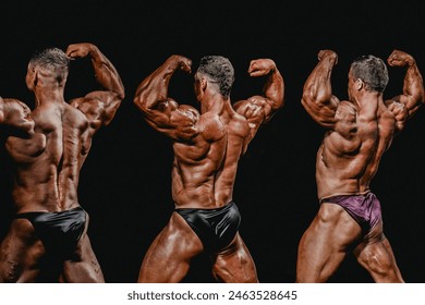 group bodybuilder athlete show back double biceps for bodybuilding competition - Powered by Shutterstock