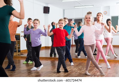 Group Of Boys And Girls Studying Contemp Dance In Studio