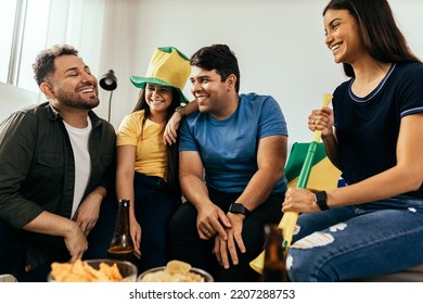 Group Of Brazilian Friends Watching A Football Match On TV