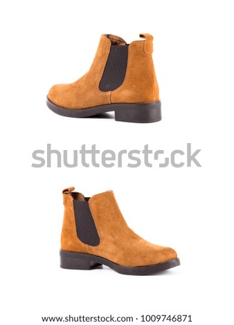 Group of brown leather boots on white background, isolated product, comfortable footwear.