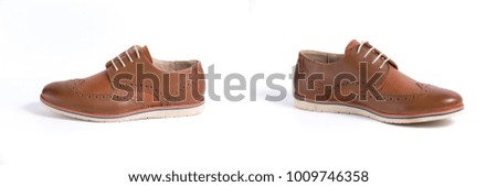 Group of brown leather shoes on white background, isolated product, comfortable footwear.
